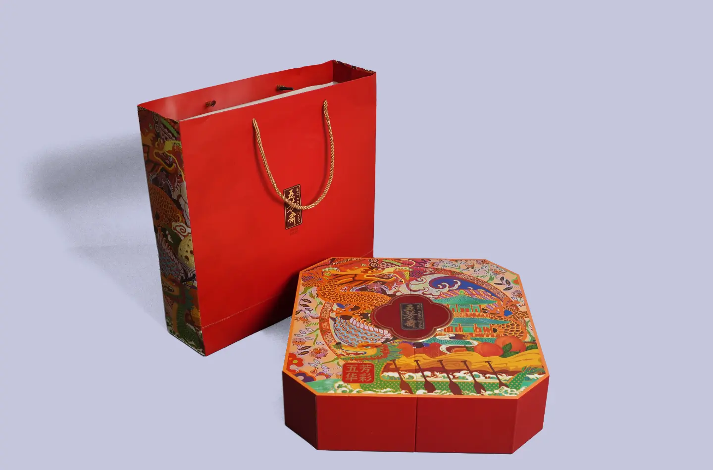 Customized magnetic closure rigid gift box paired with a matching gift bag, displayed from the front
