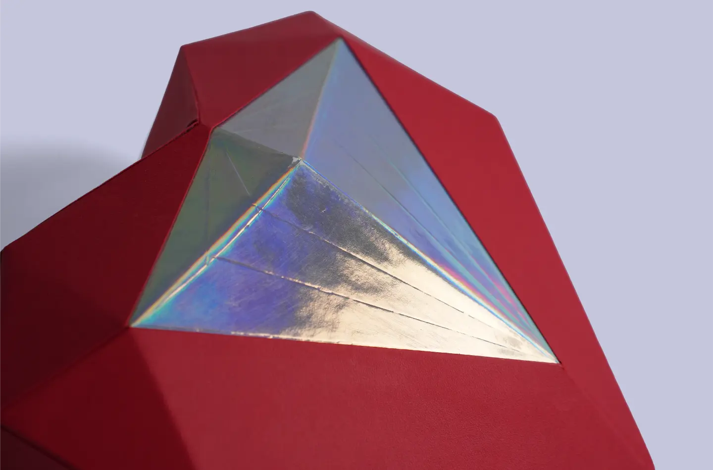 Custom red heart-shaped telescopic box featuring silver holographic finish, close-up view of surface detailing