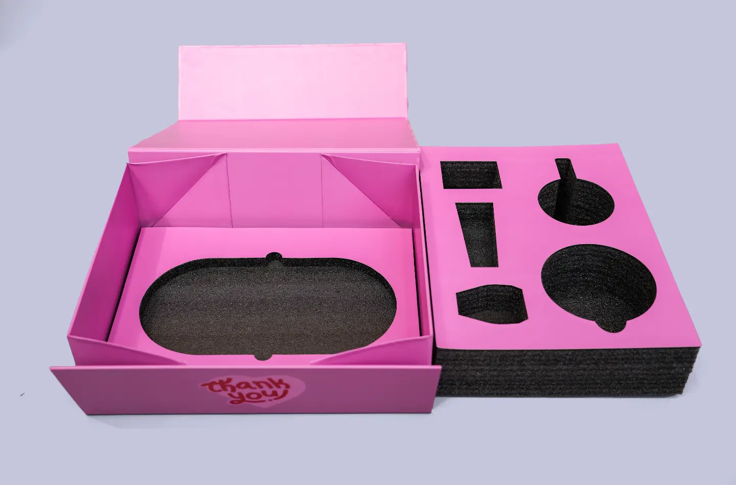 Opened high-end tea folding flip lid box with heart-shaped UV embossed surface, front-facing display of internal foam layout