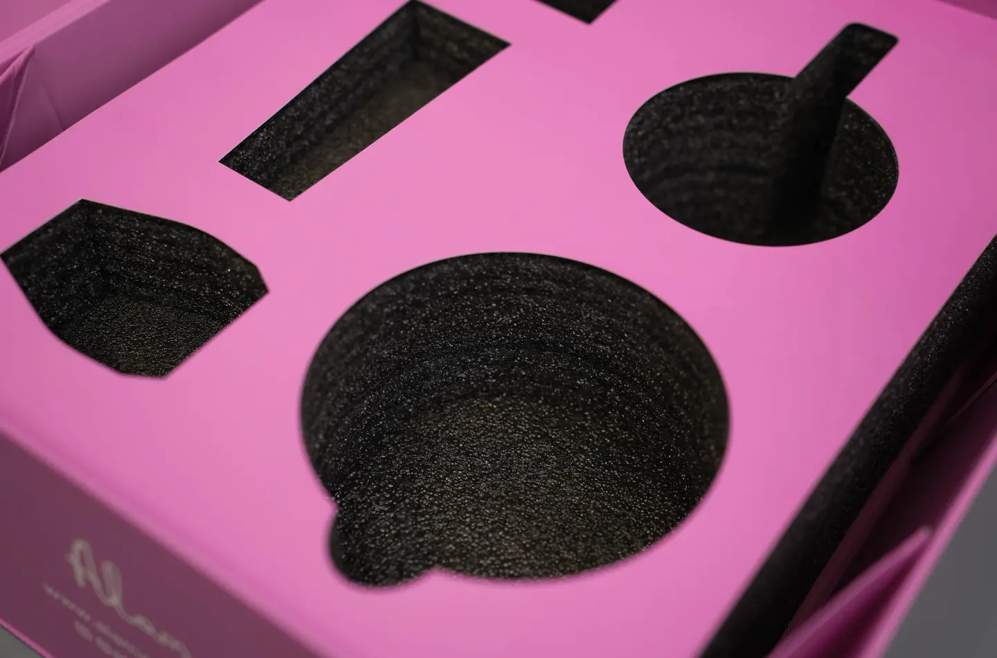 Opened high-end custom tea folding flip lid box showing detailed close-up of foam lining, featuring heart-shaped UV embossed surface