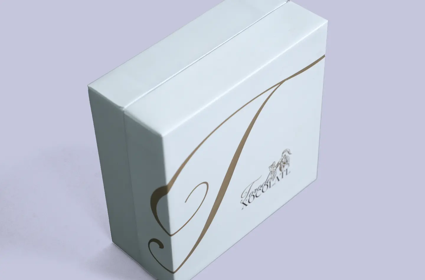 Closed luxury chocolate telescopic rigid box featuring gold foil surface and visible corner structure from the side