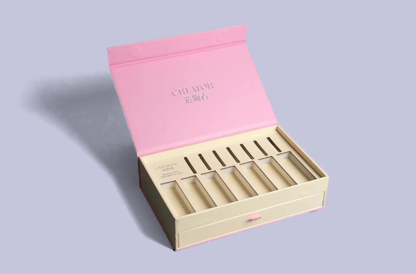 Detail shot showing foam lining inside a luxury cosmetic magnetic closure drawer box with silver foil finish