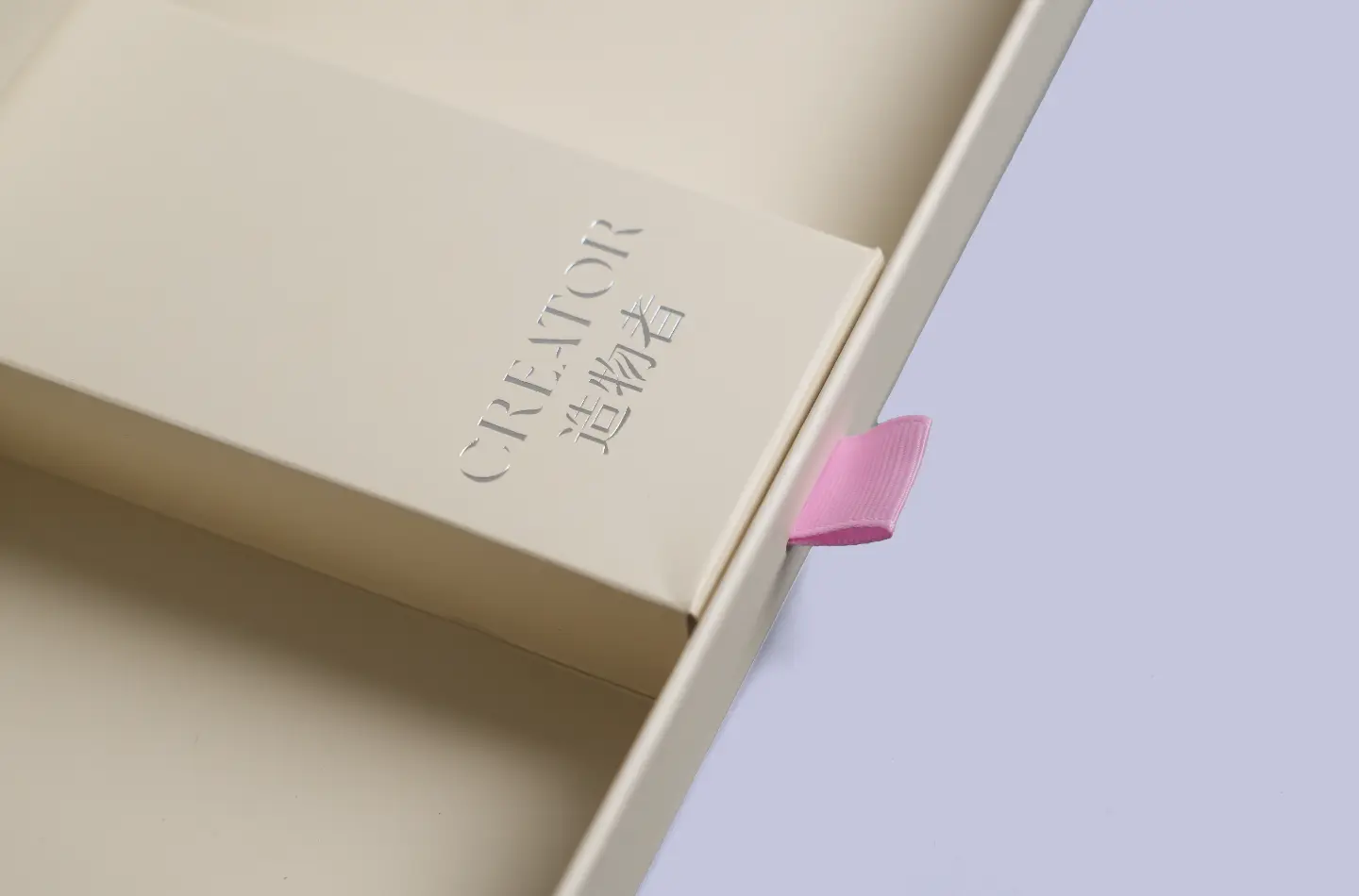 Detail view of the drawer section in a luxury cosmetic magnetic closure flip lid box with silver foil finish