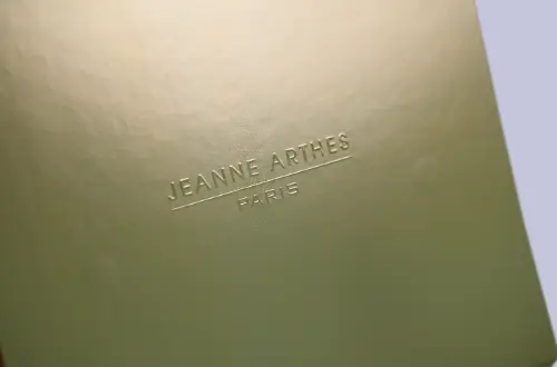 Detail shot showing embossed pattern on the surface of a gold magnetic flip-cover drawer box with interior EVA lining