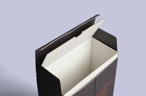 Interior insert detail displayed inside an opened embossed and gold-stamped cosmetic tuck box
