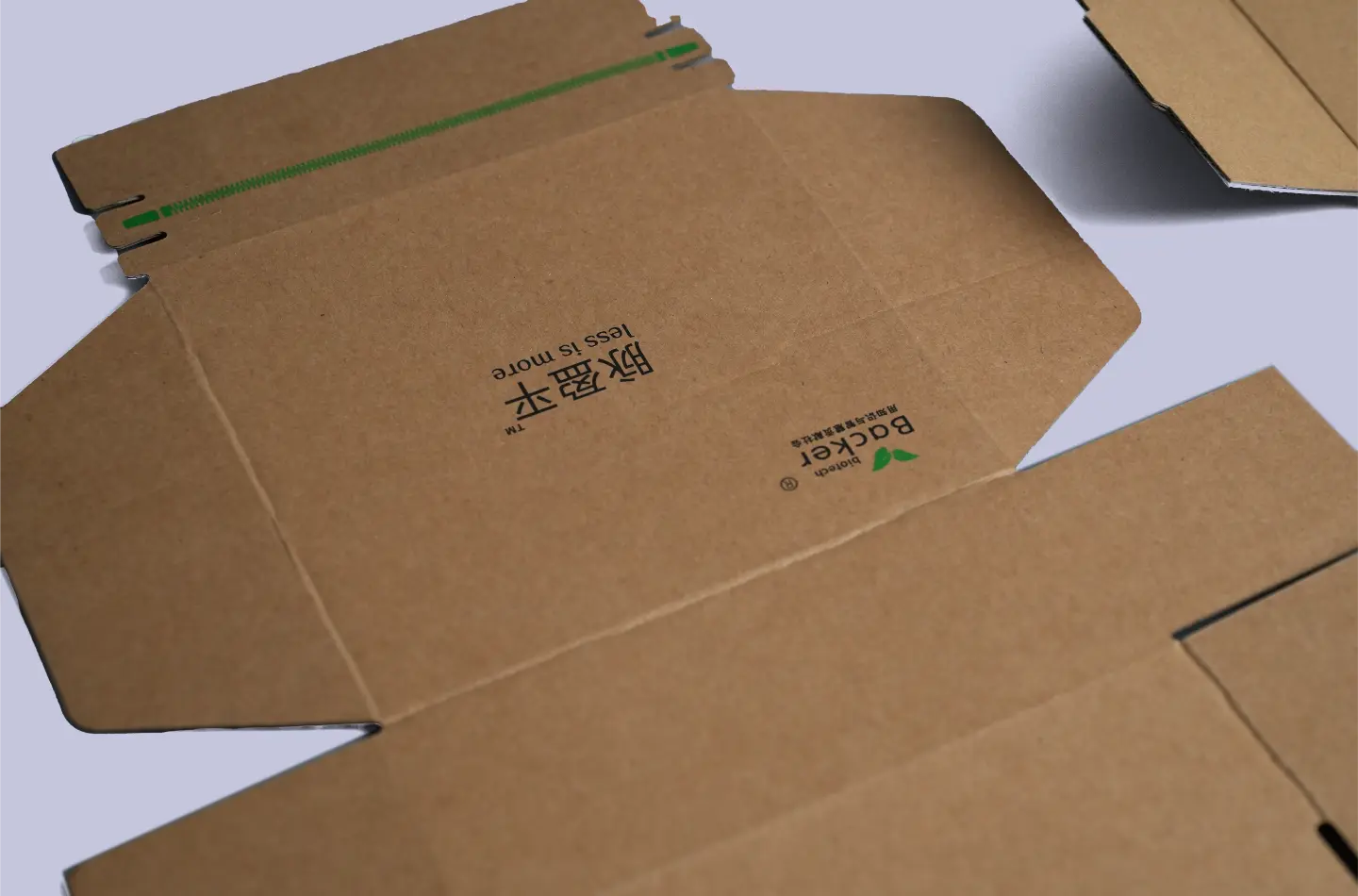 Detailed view showing surface screen-printed design on a custom corrugated packaging tuck box with tear strip