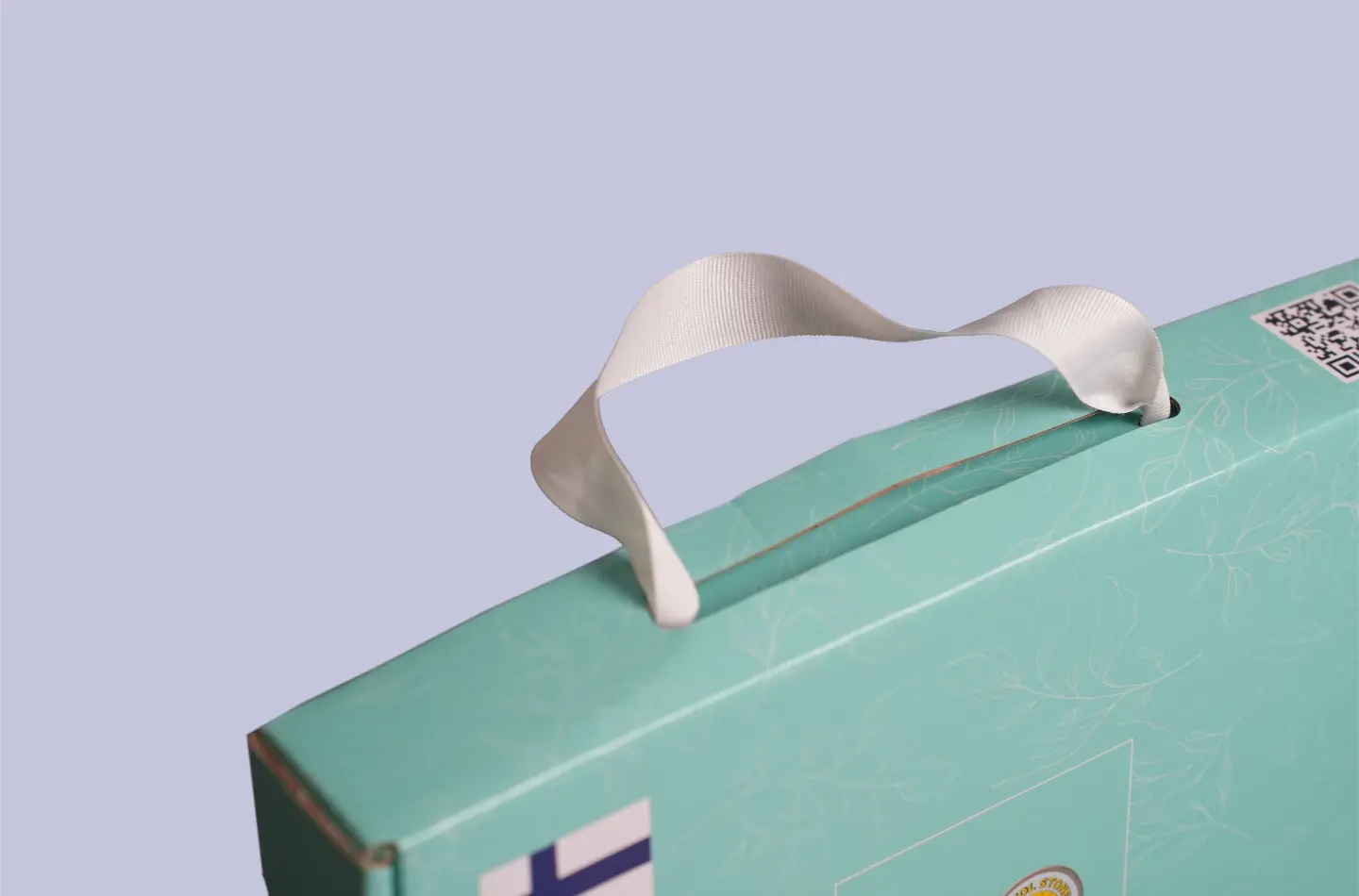 Detailed view showing the ribbon detail on a high-end ribbon-adorned flip-top tuck box for the food industry