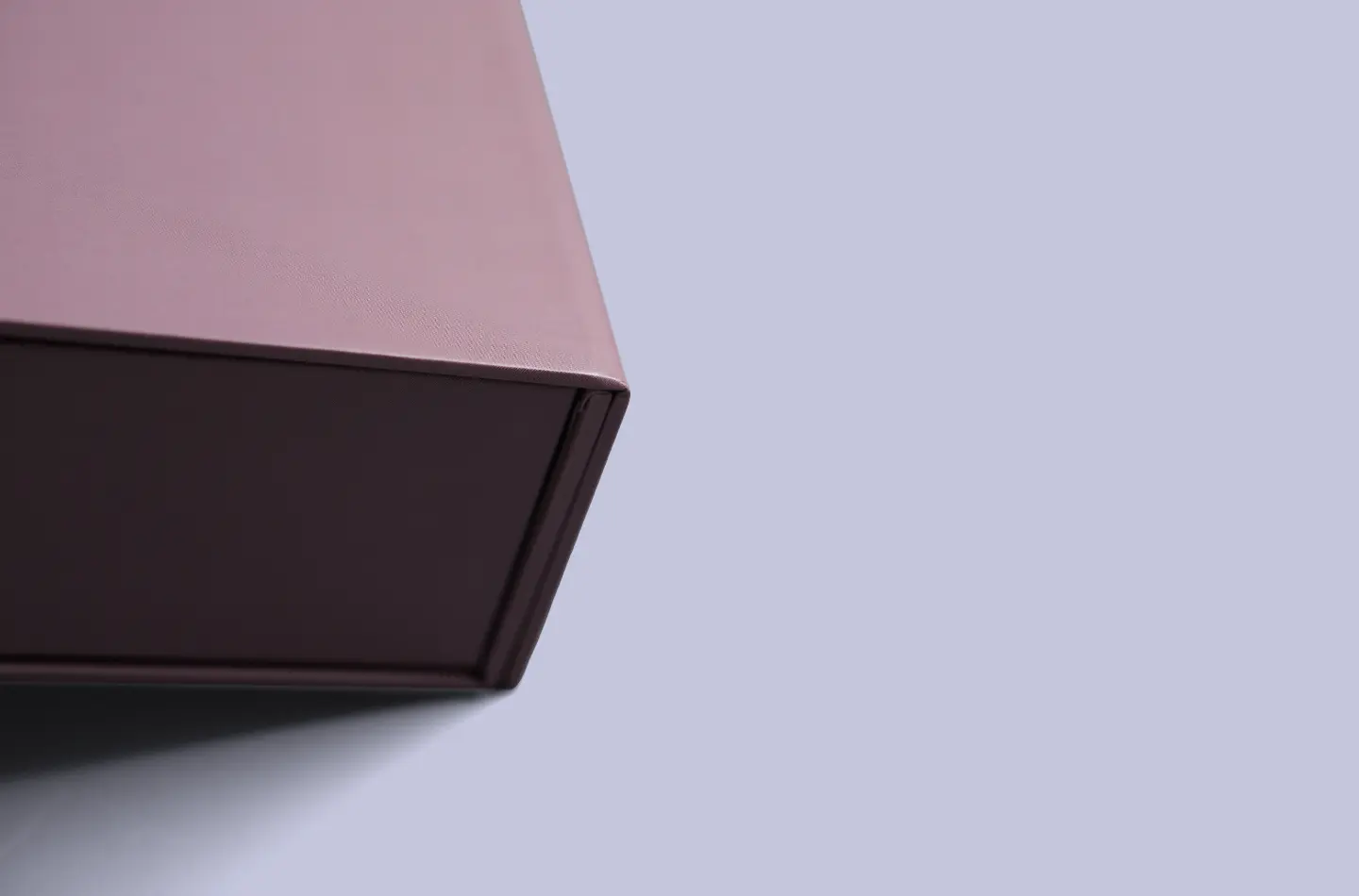 Luxury custom purple flip-top box with magnetic closure and UV printing, close-up of the folded edges