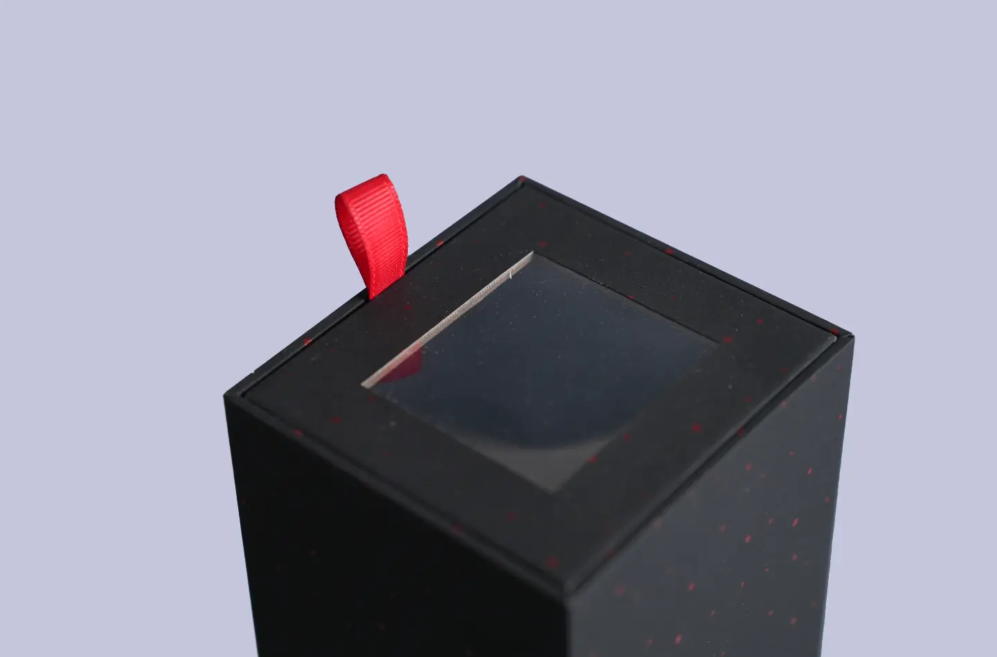 Close-up of the side window opening on a black and red drawer-style box with UV printing