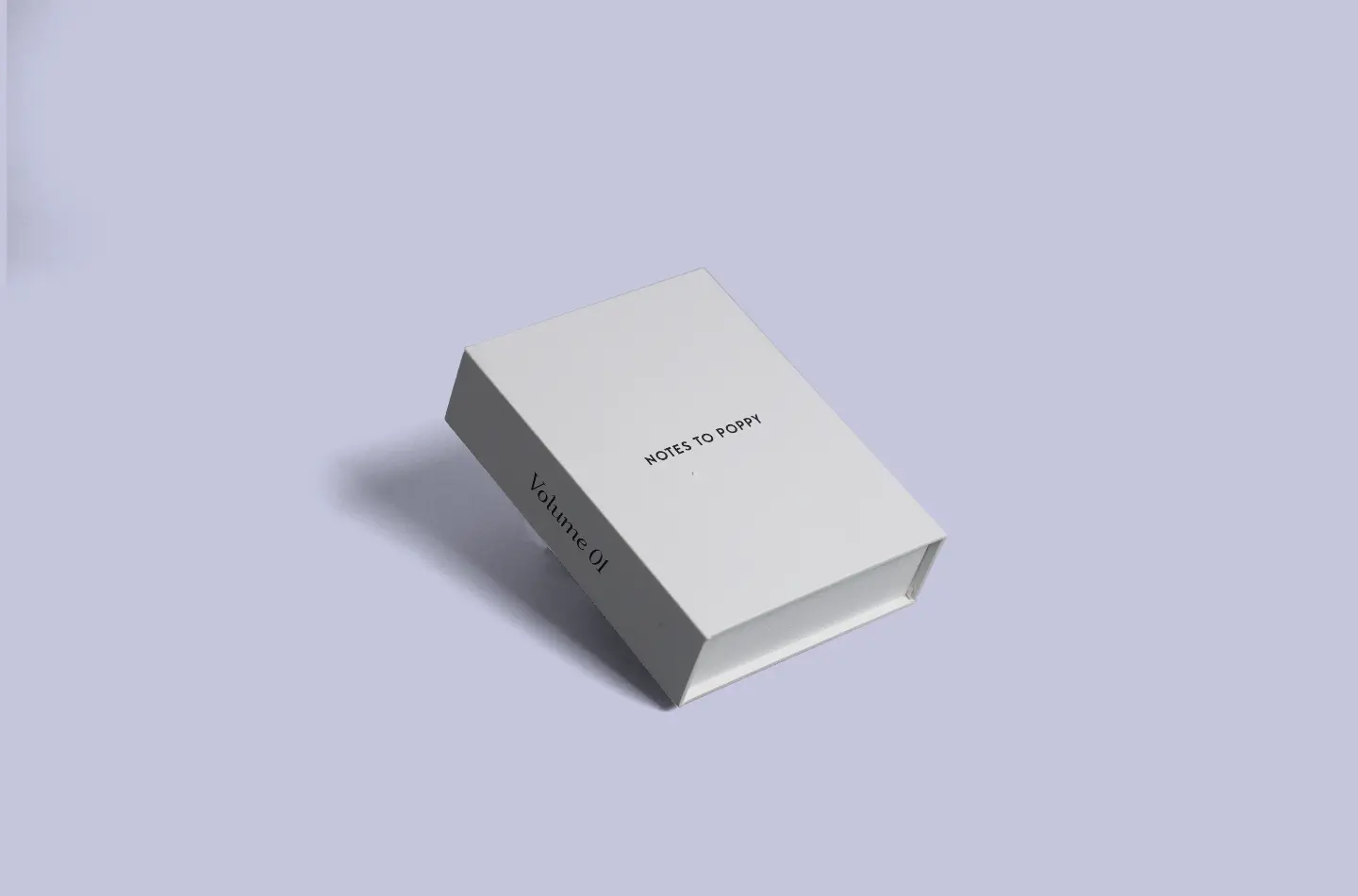 White book-style packaging box with special surface texture and inner lining, shown from the front