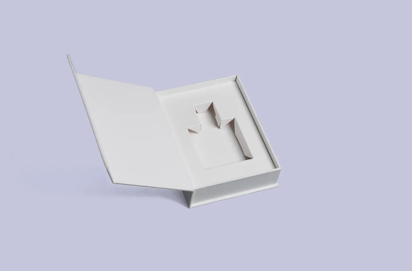 White book-shaped box featuring a textured exterior and inner liner, displayed open from the front