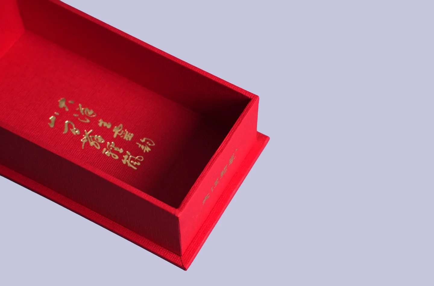 Red flip-top box, close-up of the inner box with gold foil details