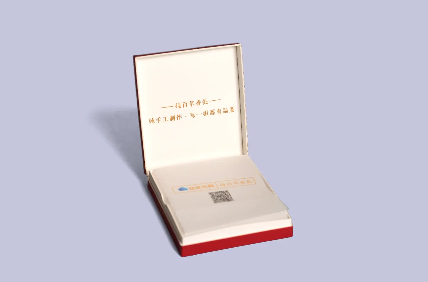 Custom red flip-top cardboard box with unique texture and gold foil stamping, shown open from the front