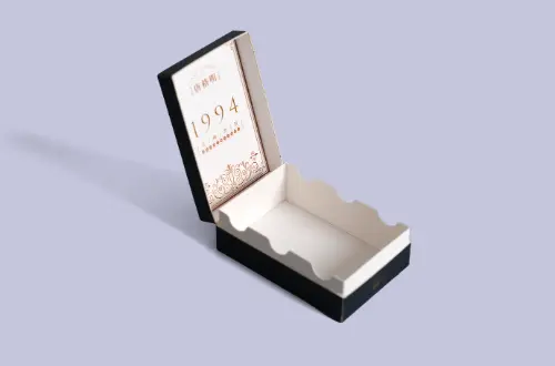 Open front display of an olive-green flip-top paperboard box featuring a laminated and embossed exterior