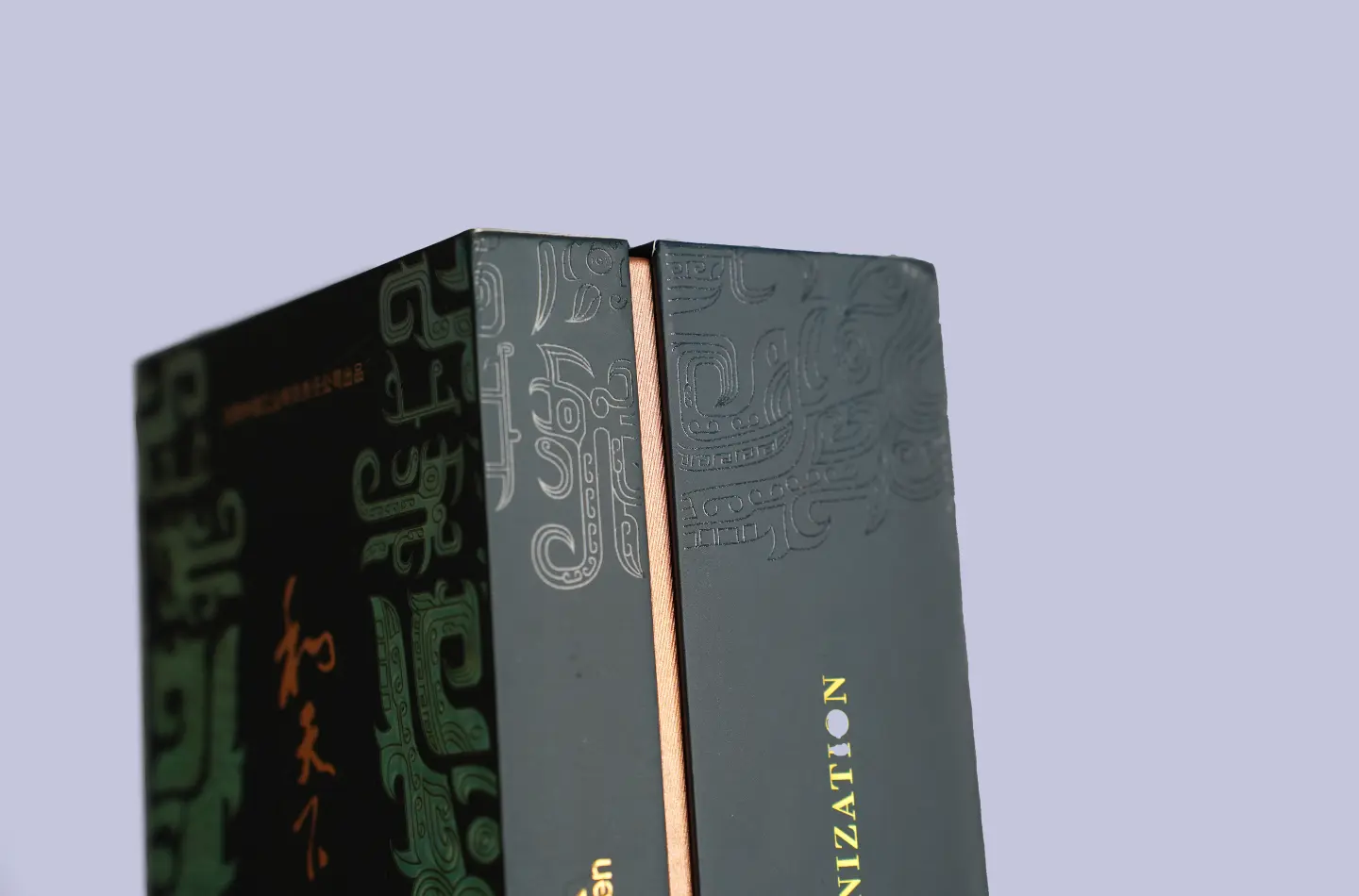 Close-up of the hinge and side opening on the luxury book-shaped packaging box featuring gold foil stamping and UV print