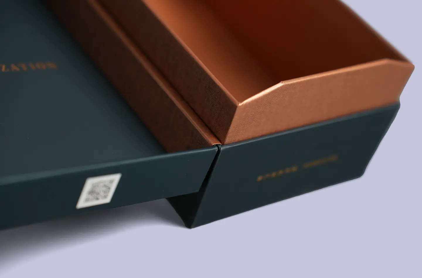 Macro shot showing the hinge and open-close detail on the luxury book-style box with UV printing and gold foil finishing