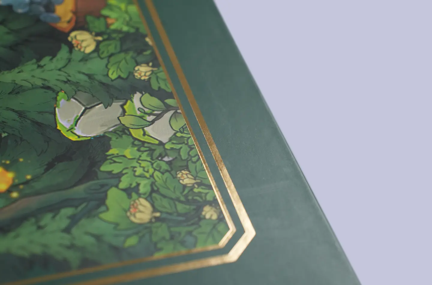 Gold foil accent close-up on the surface of a luxury magnetic lift box featuring an interior foam insert