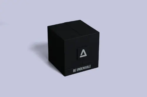 Close-up of the front surface detailing on a high-end black magnetic gift box featuring silver foil stamping