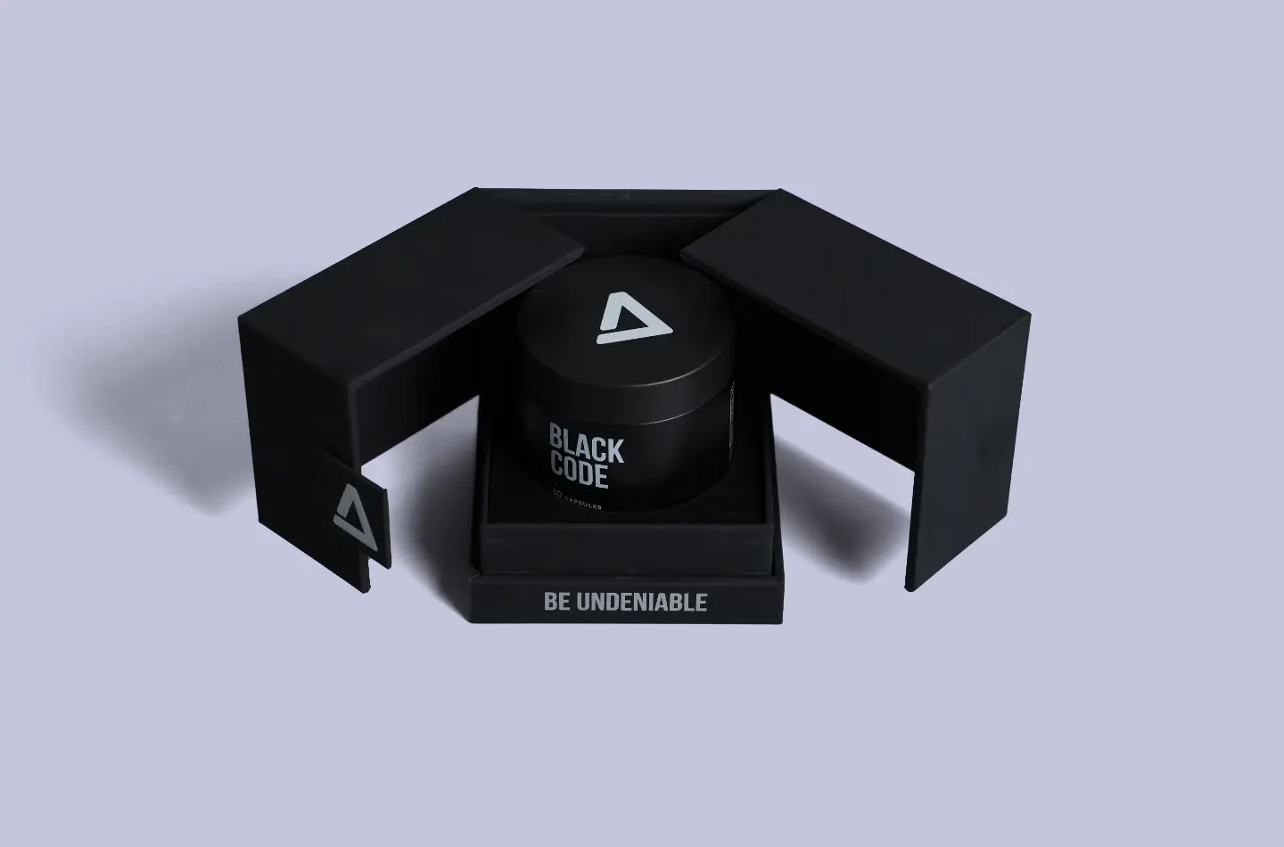 Open front-facing display of a high-end black magnetic gift box featuring silver foil stamping