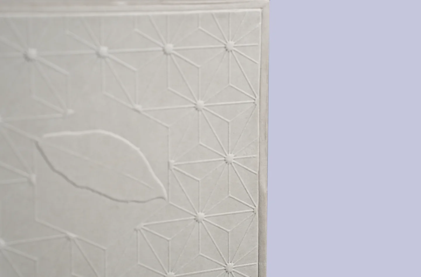 custom gray flip lid tea box for tea packaging with gold foil stamping and embossed surface, displayed to showcase embossed details