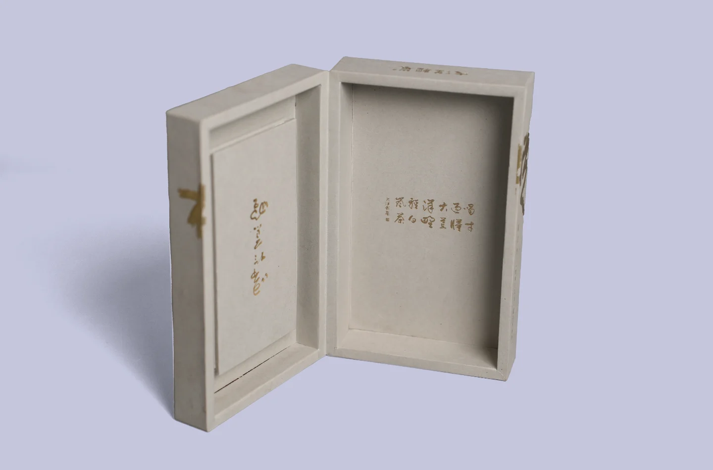 custom gray flip lid tea box featuring gold foil stamping and embossed finish, shown opened upright from the front highlighting details