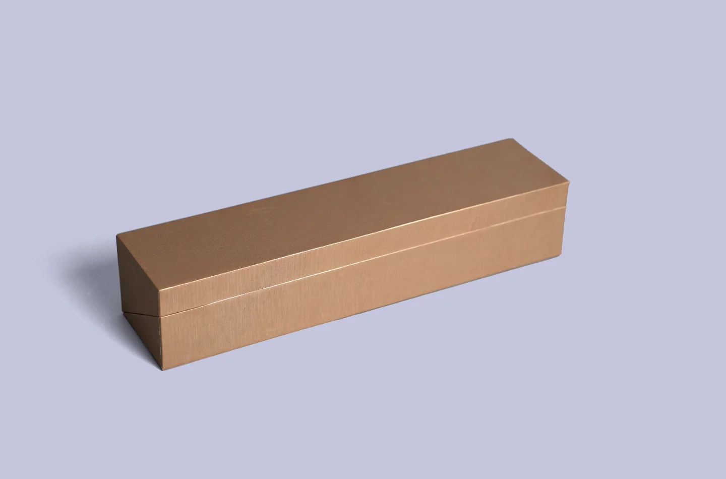 custom brown flip lid box designed for apparel packaging with a special pearlescent paper laminated surface, displayed from the front to showcase details