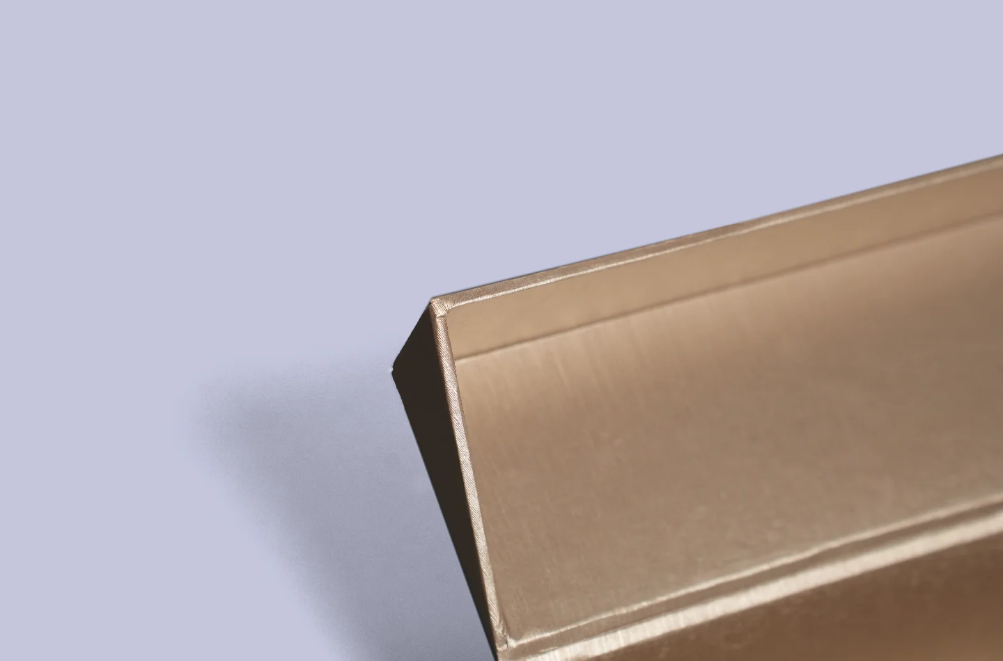 custom brown flip lid box for apparel packaging featuring special pearlescent paper lamination, shown opened to highlight interior details