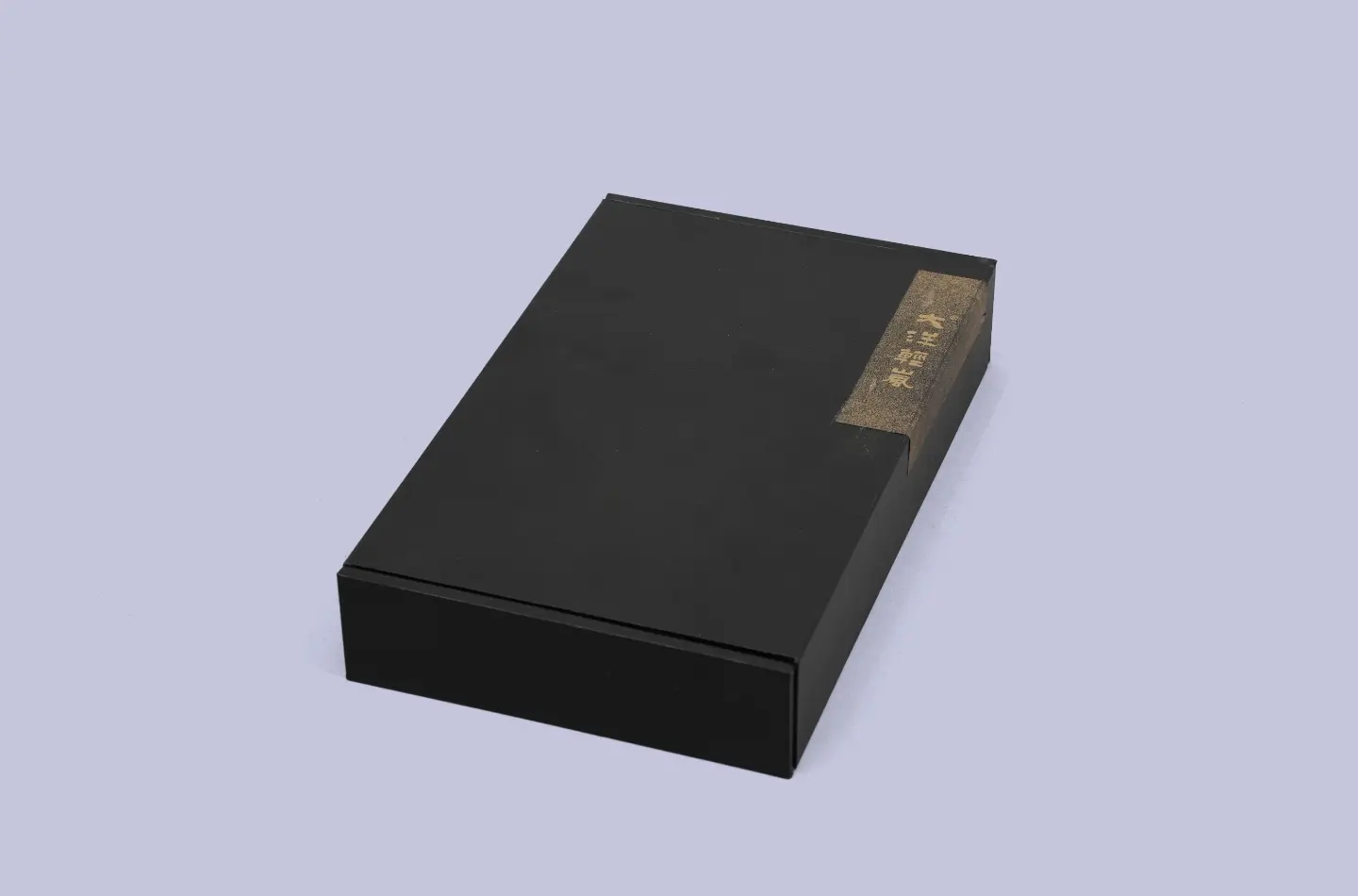 premium custom black tea magnetic book-style box with specialty paper surface displayed from the front view
