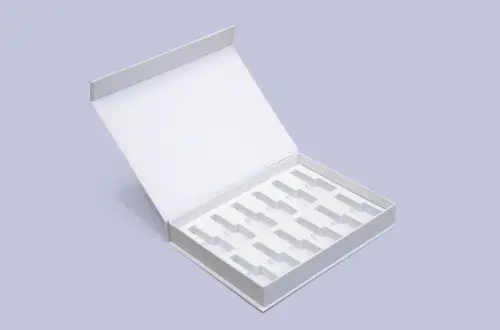 premium custom white cosmetics book-style box featuring EVA insert and pink logo showcasing the fully open front view