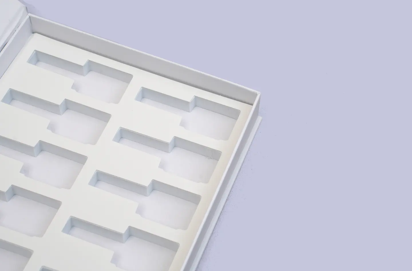 premium custom white cosmetics book-style box featuring EVA insert showcasing interior detail with pink logo