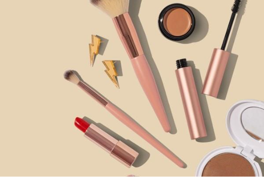 A group of makeup brushes and lipsticksAI-generated content may be incorrect.