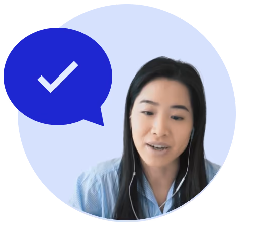 Woman speaking on a video call beside a speech bubble with a checkmark