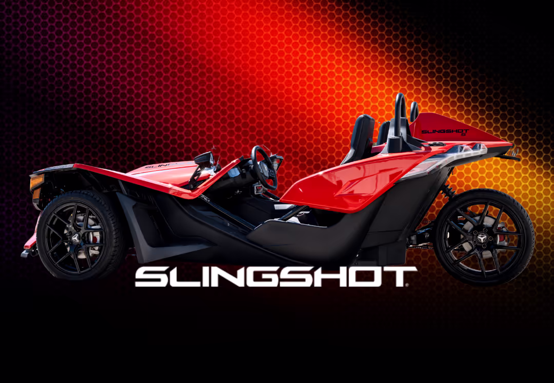 A beautifully displayed red Polaris Slingshot SL, available to rent in Houston