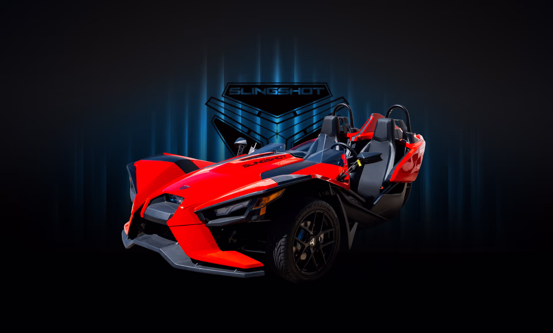 A beautifully displayed red Polaris Slingshot against a blue background, available to rent in Houston