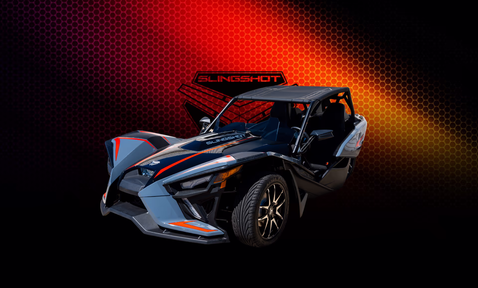 A beautifully displayed blue Polaris Slingshot, available to rent in Houston
