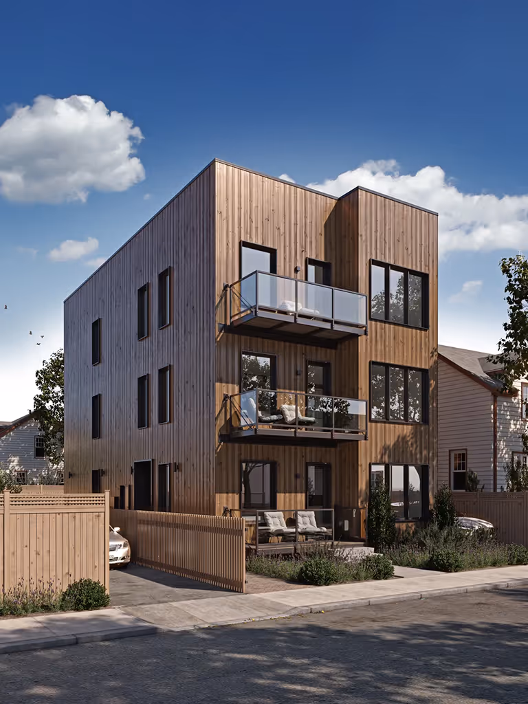 Three-story modern house with balconies, wooden fences, trees, and parked cars on a sunny day.