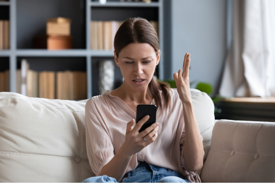 An angry lady, frustrated with a phone conversation