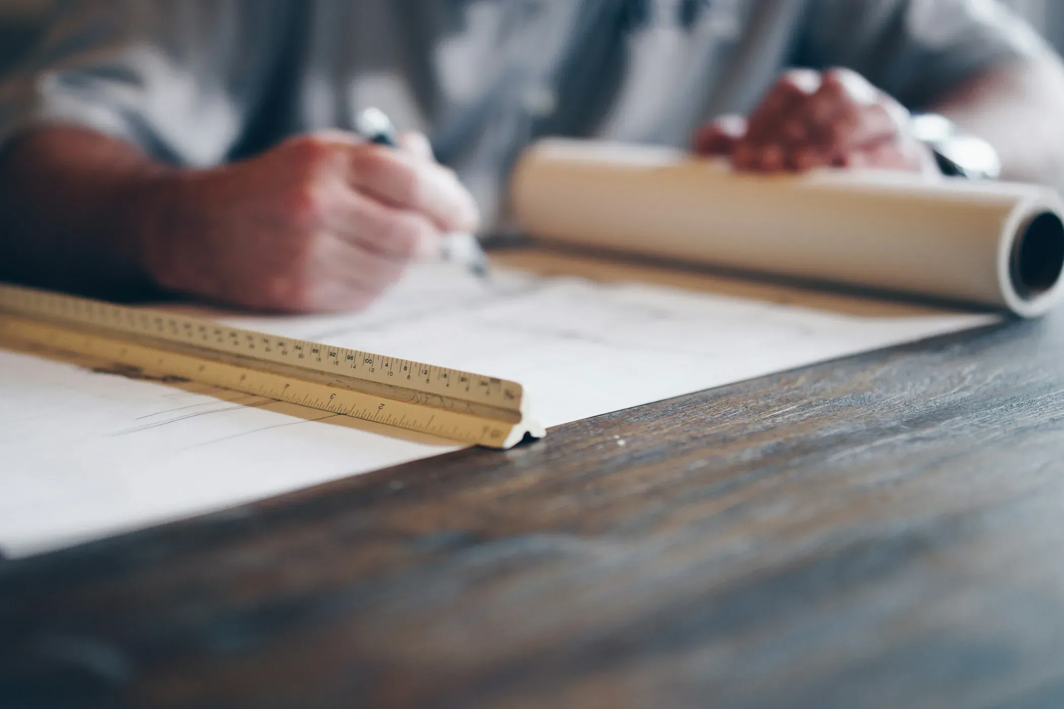 Building drawings and measuring tools on a table