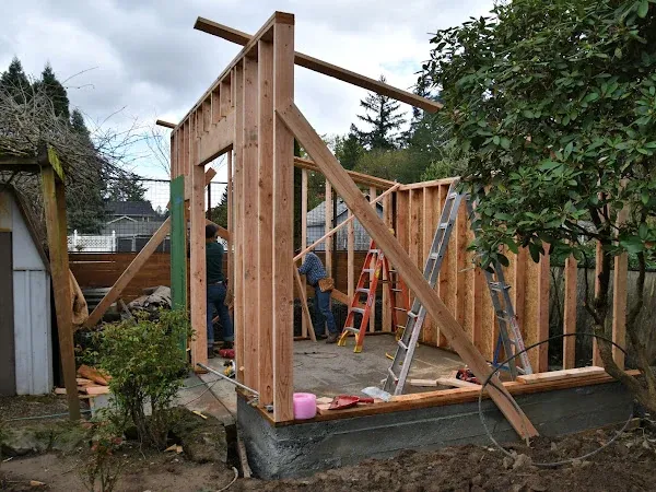 Wood wall framing and bracing for a small backyard building