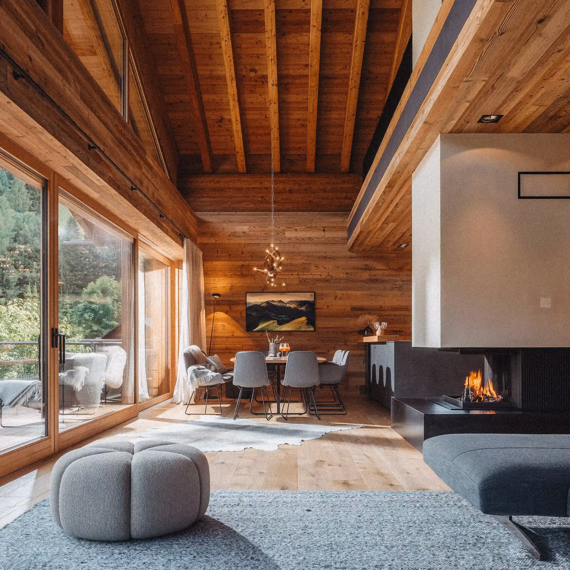 Falk lounge with fire place and warm daylight