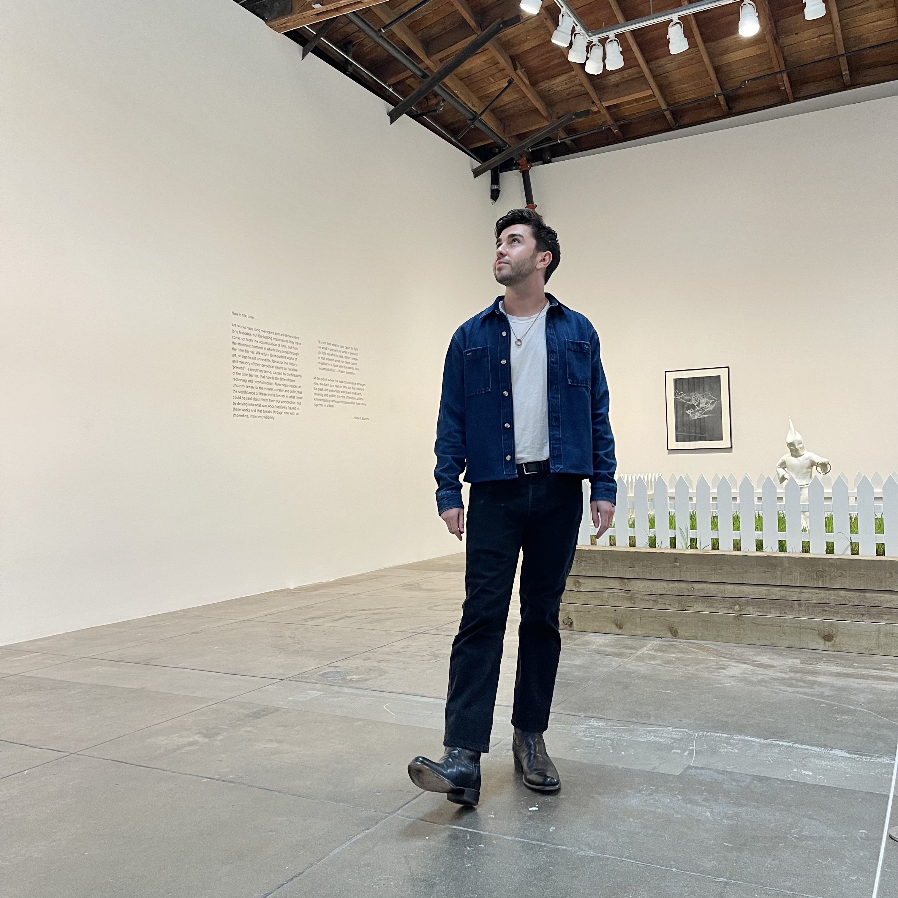 a web developer in a museum looking up