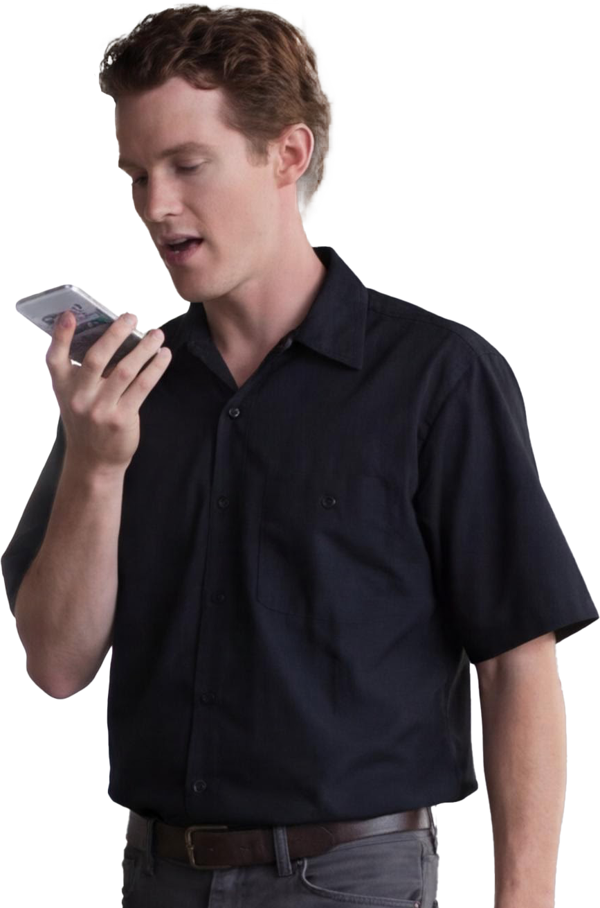 Restoration technician speaking a scope walkthrough into a phone on site
