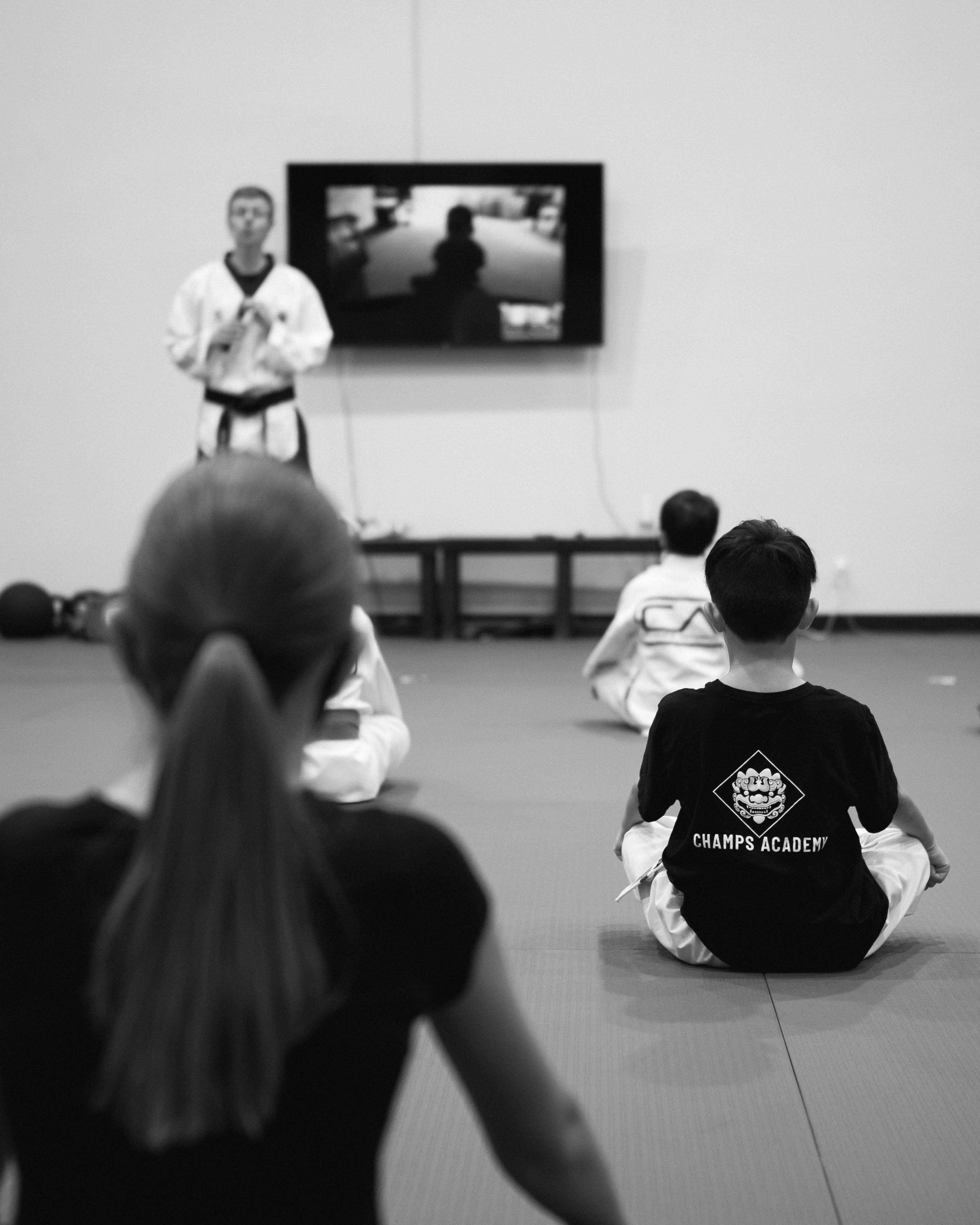 An instructor teaching a Taekwondo class