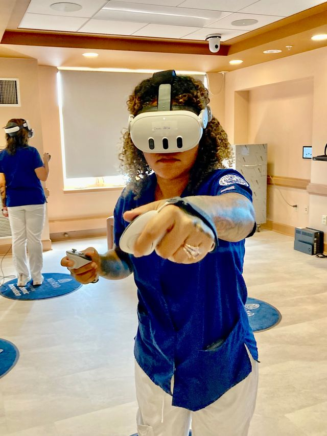 A student experiences a VR nursing simulation.