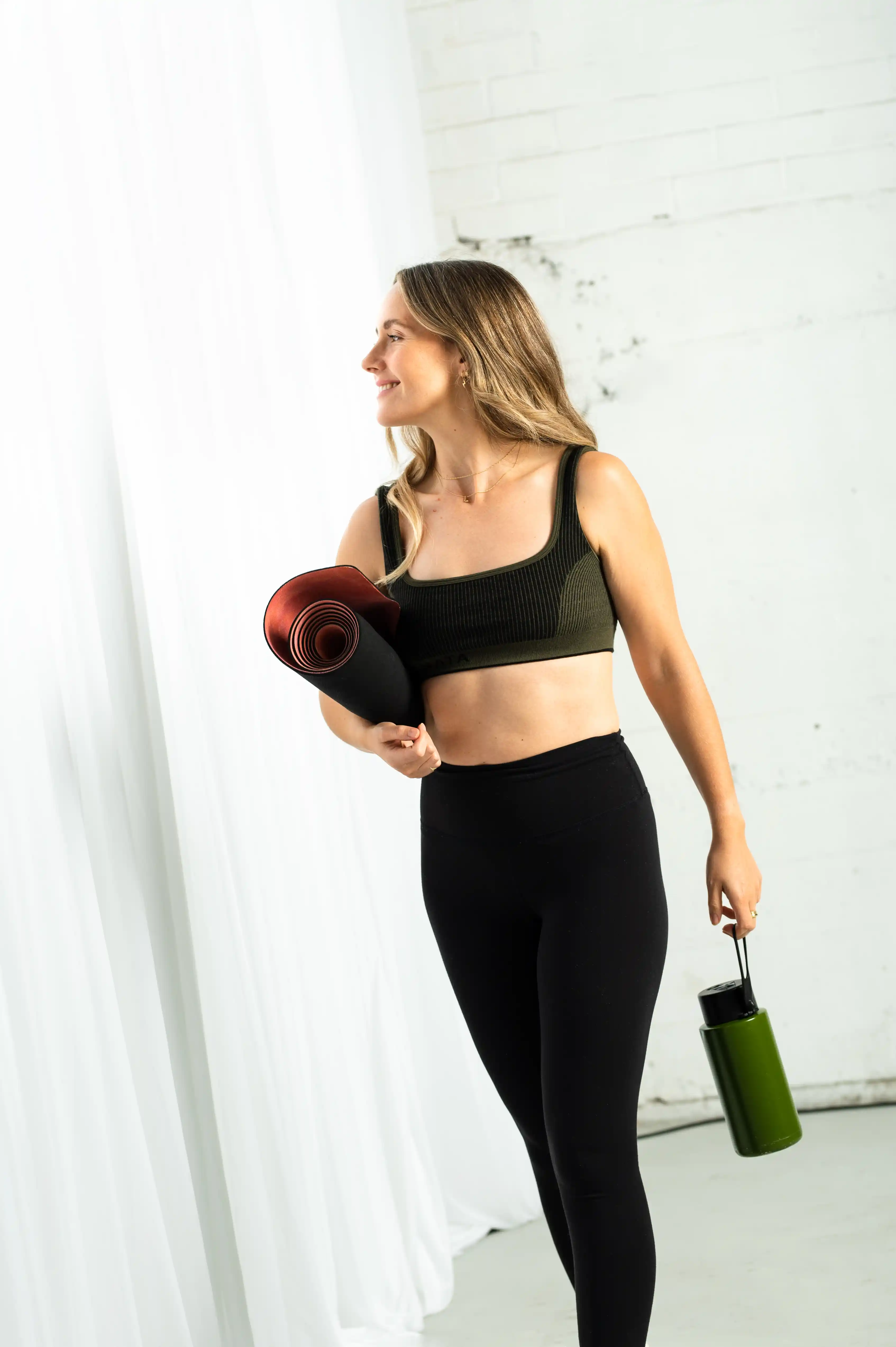 Urban street view with a tall building labeled Burns House and three parked white taxis on the roadway.