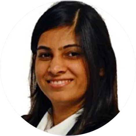 Smiling woman with long dark hair wearing a white blouse and black jacket.