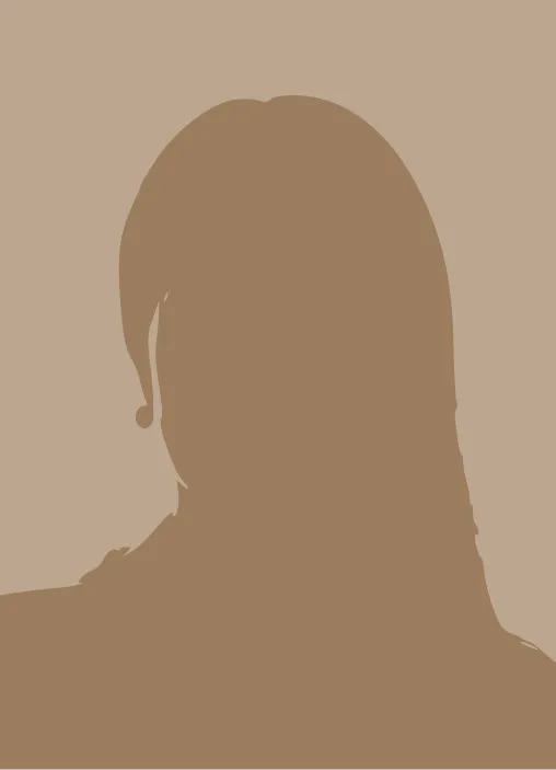 Silhouette of a person with long hair against a solid beige background.