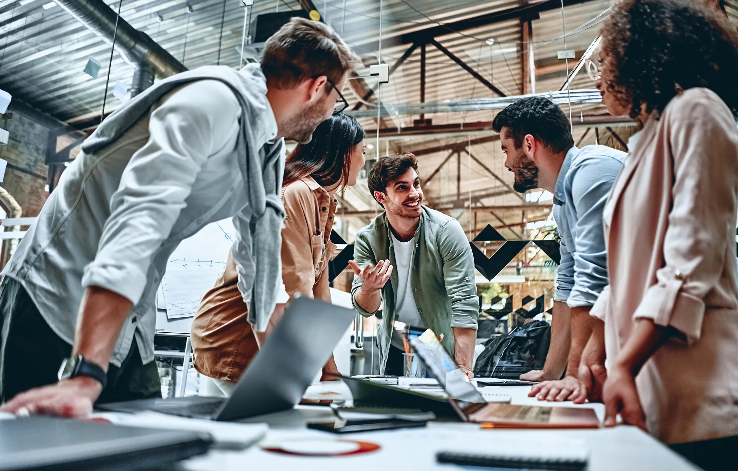 Team working together in a busy industrial workspace