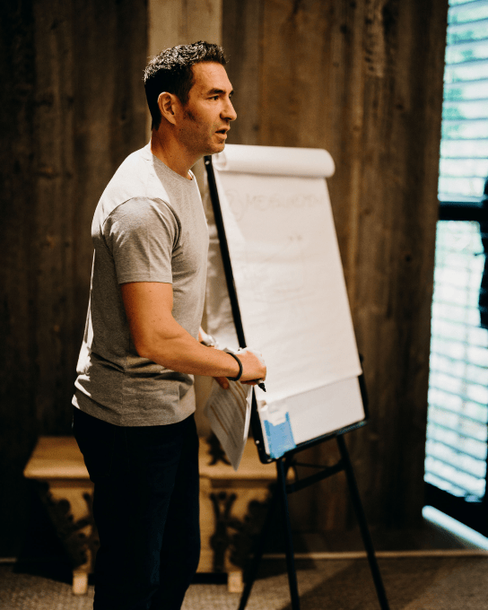 Tsen stood next to a whitebaord