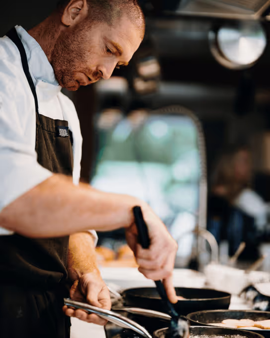 Chef preparing food for retreat members